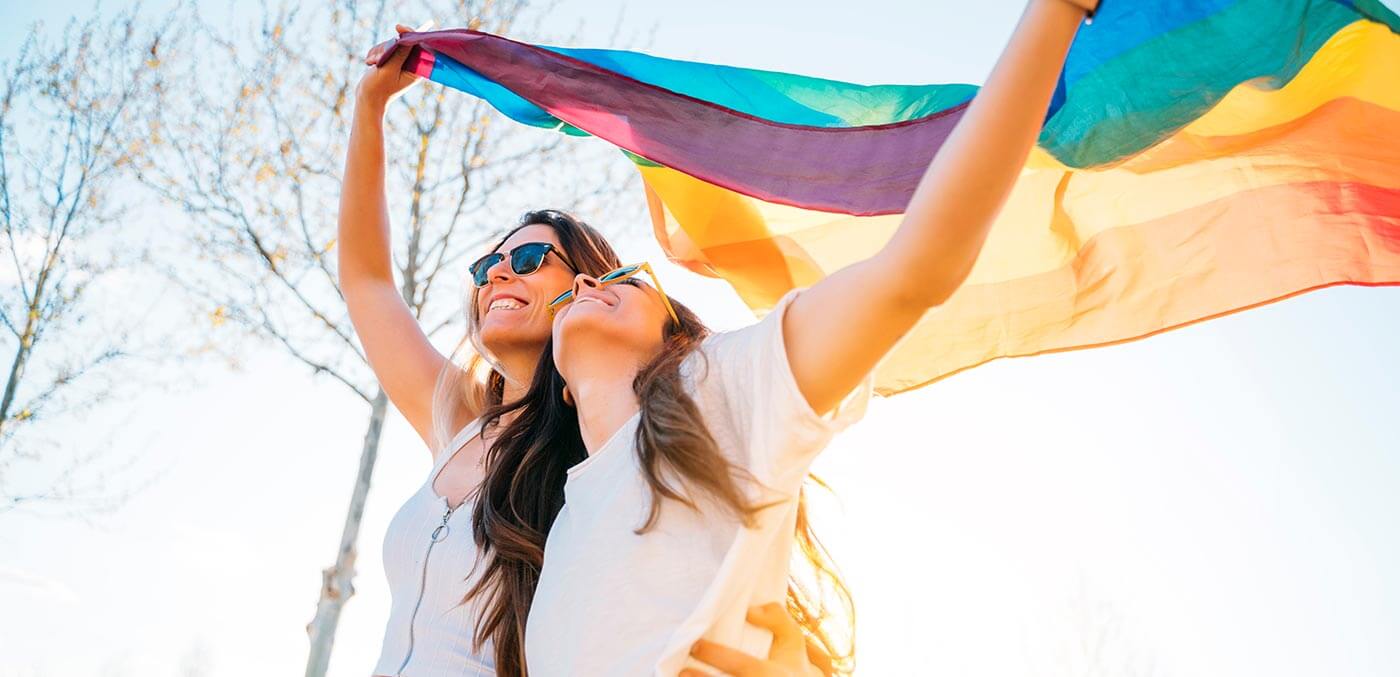 A couple with the pride flag