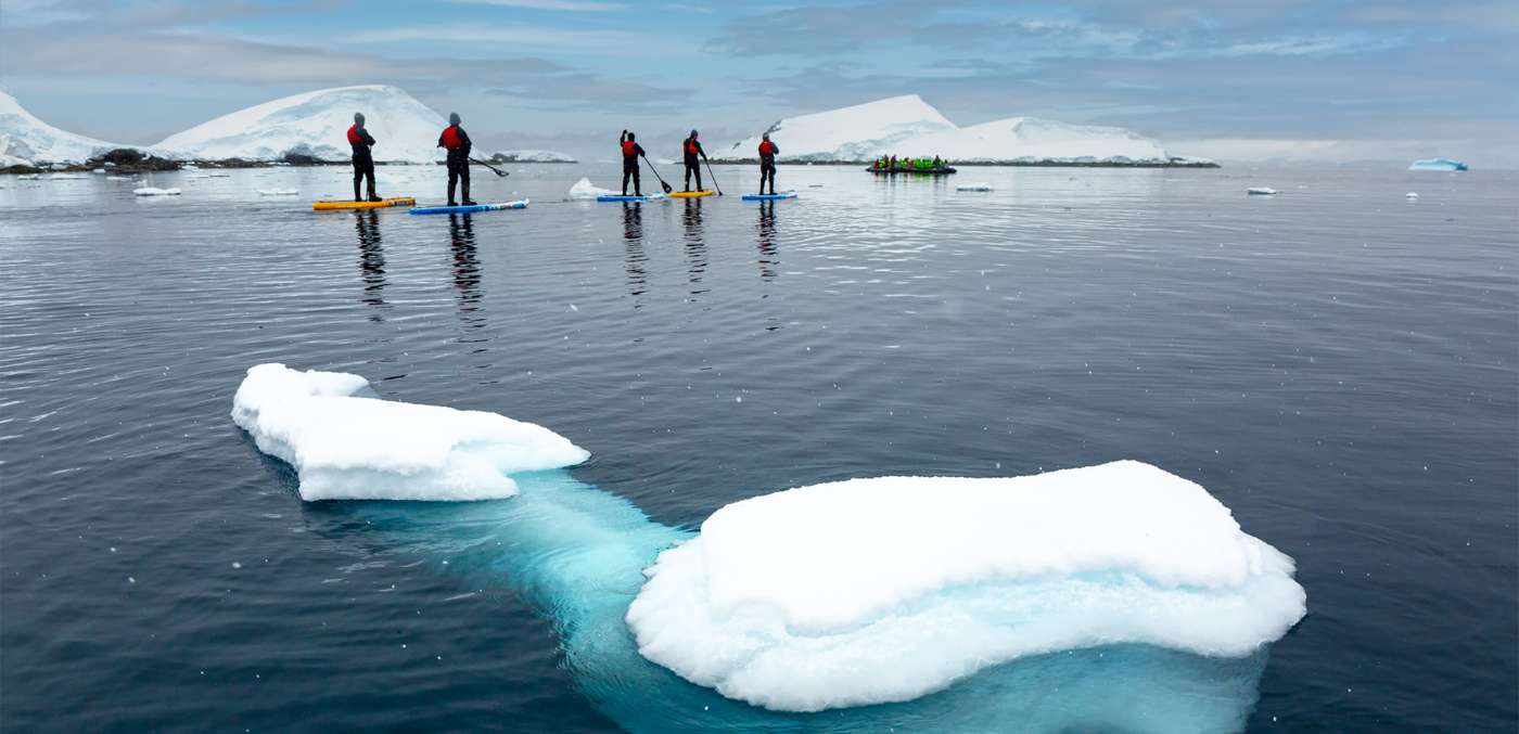 Stand Up Paddleboarding on an expedition cruise with Atlas Ocean Voyages