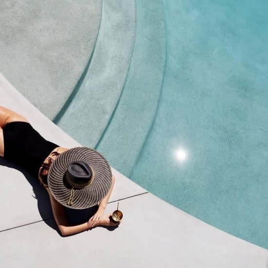 woman laying by pool