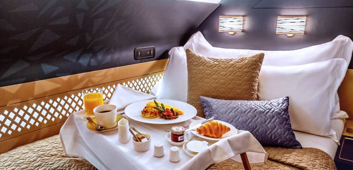 breakfast tray sitting on bed in aircraft